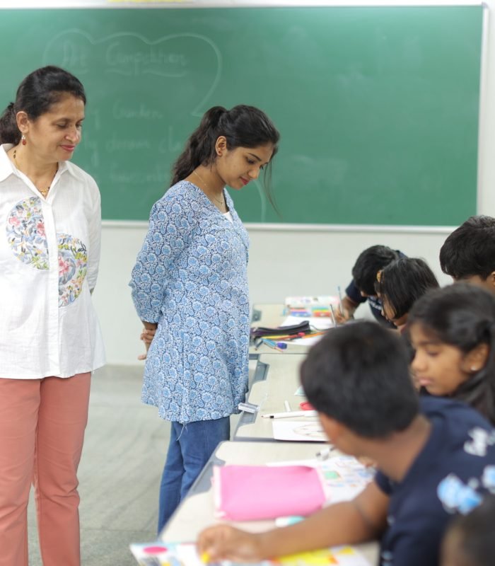 05_journey_blurred-children-teachers-classroom_16x9.jpg